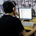 A man browses web at an Internet cafe in&nbsp;Madrid
