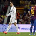 Real Madrid’s Ronaldo walks past Barcelona’s Messi after scoring his goal during their Spanish first division “El Clasico” soccer&nbsp;match
