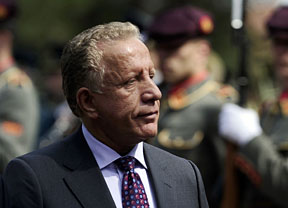 Kosovo's newly elected President Behgjet Pacolli reviews an honour guard during his meeting with his Macedonian counterpart Gjorge Ivanov at the presidential residence in Skopje